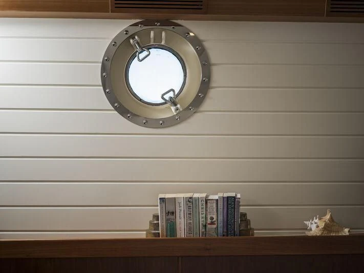 a clock on a wall aboard ALEXA OF LONDON Yacht for Sale