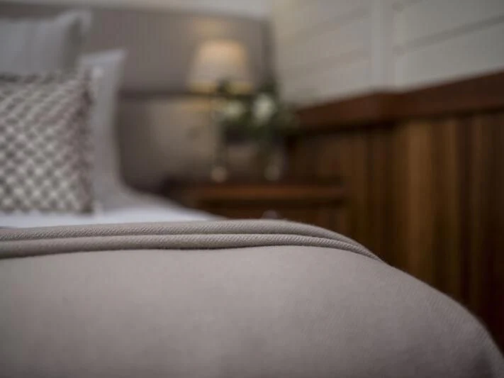 a bed with a lamp on it aboard ALEXA OF LONDON Yacht for Sale