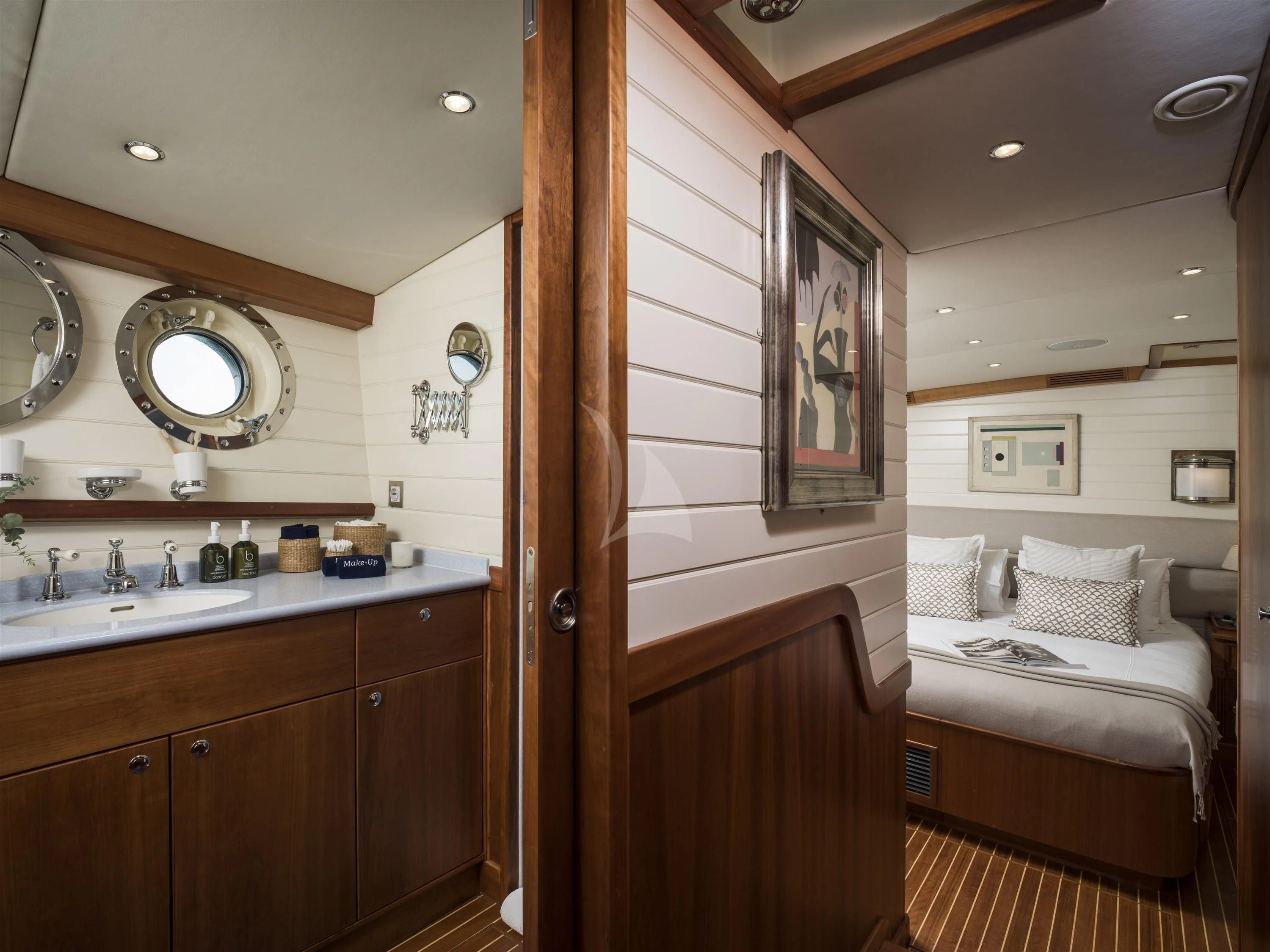 a bathroom with a bed and a sink aboard ALEXA OF LONDON Yacht for Sale