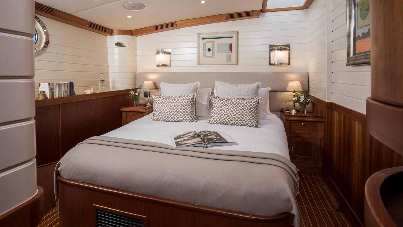 a bed with white pillows aboard ALEXA OF LONDON Yacht for Sale