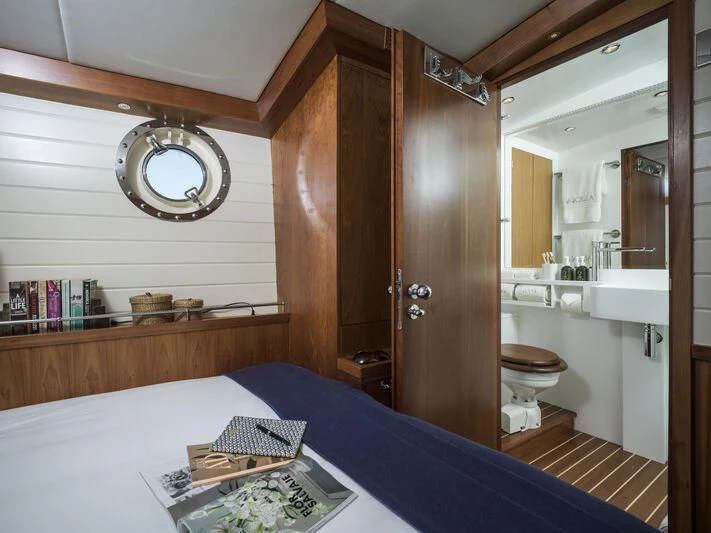 a bathroom with a large wooden shower aboard ALEXA OF LONDON Yacht for Sale