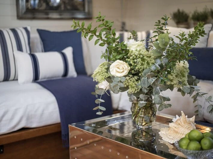 a vase of flowers on a table aboard ALEXA OF LONDON Yacht for Sale