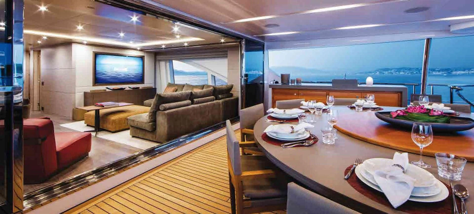 a living room with a large screen aboard COFINA Yacht for Sale