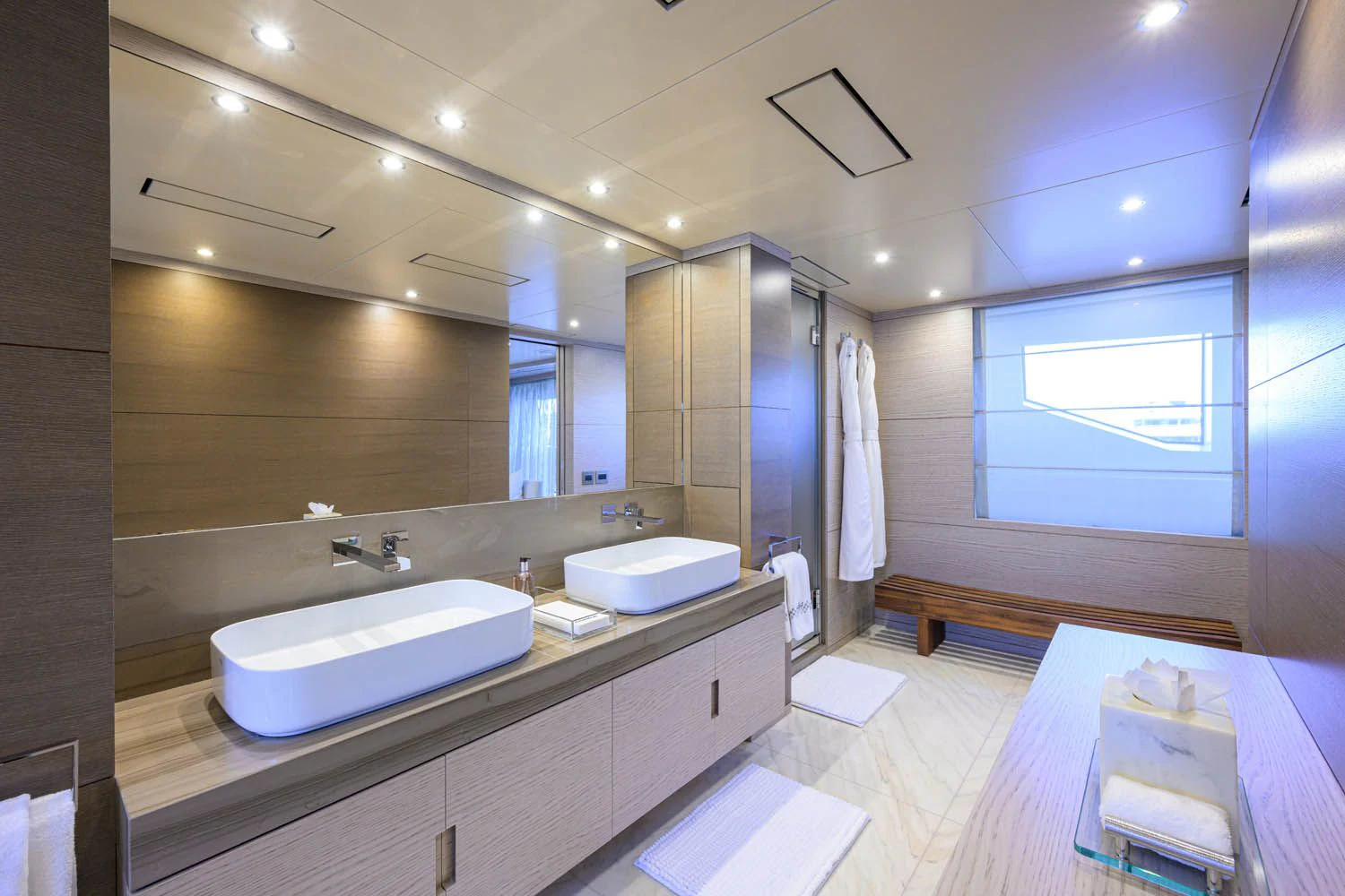 a bathroom with a large mirror aboard COFINA Yacht for Sale