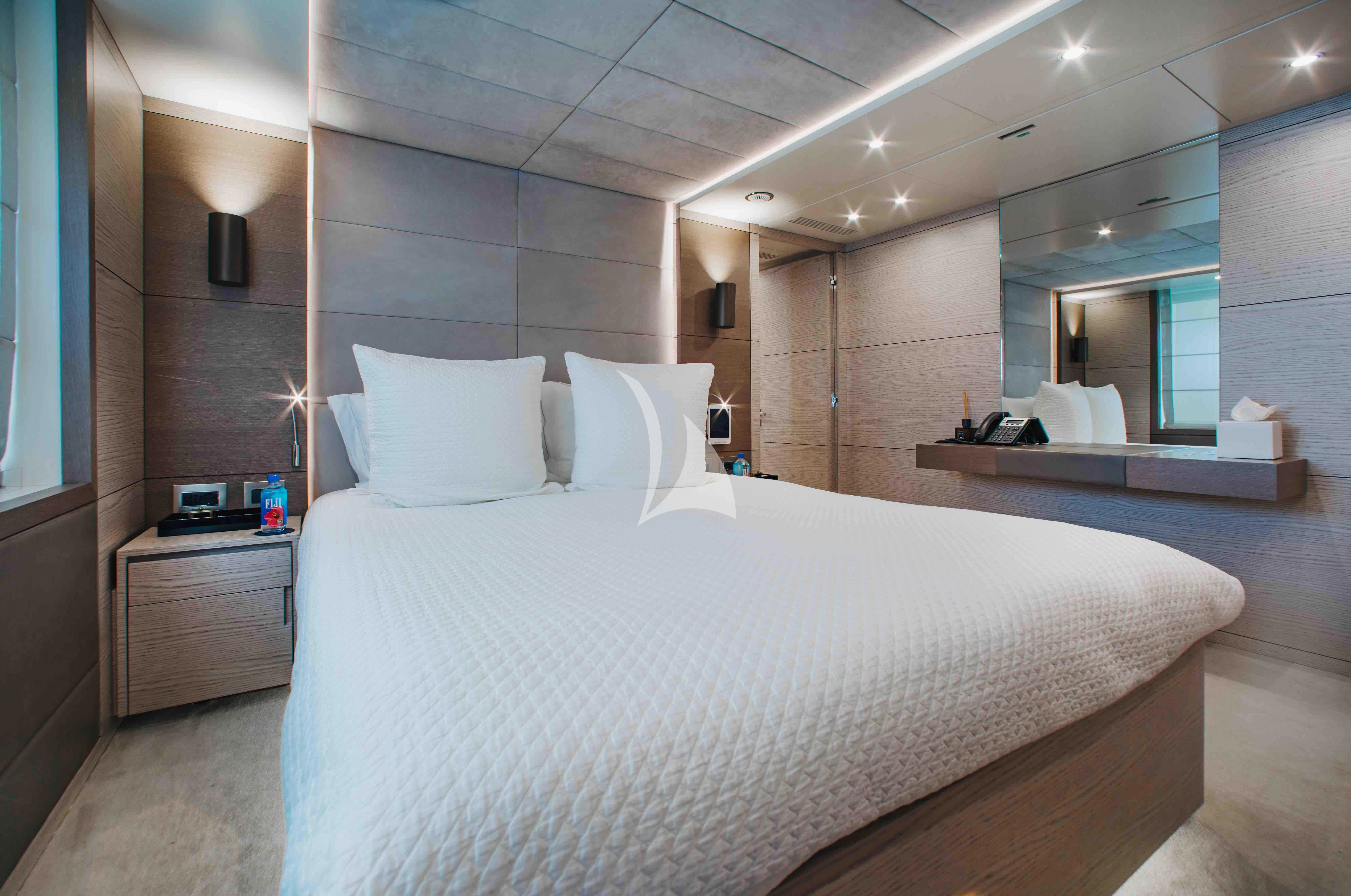 a large bed in a hotel room aboard COFINA Yacht for Sale