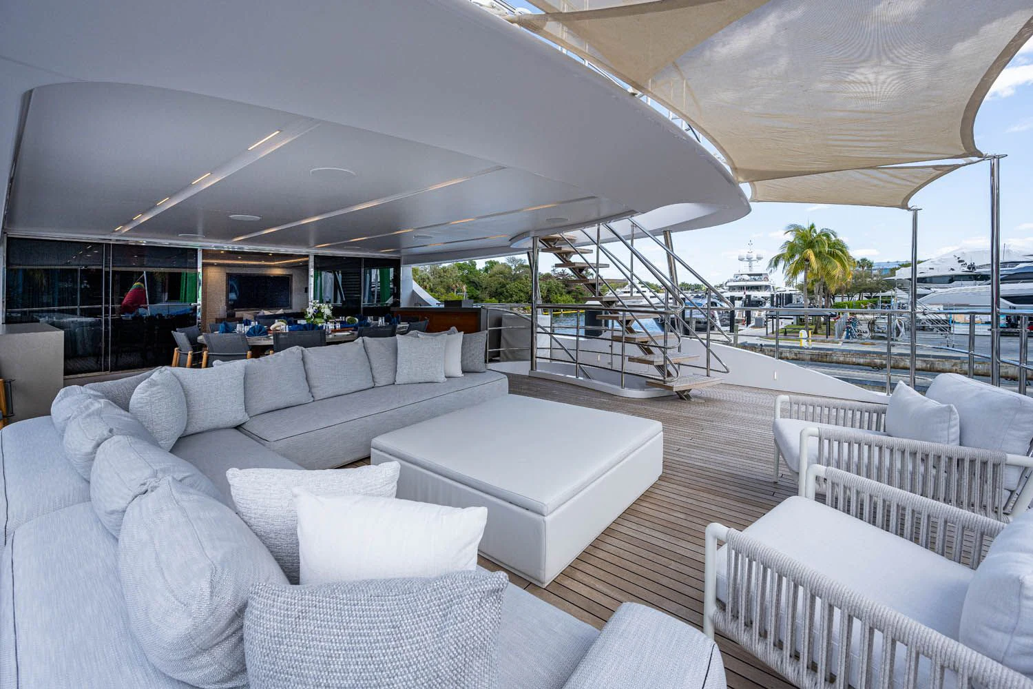 a living room with a large patio aboard COFINA Yacht for Sale