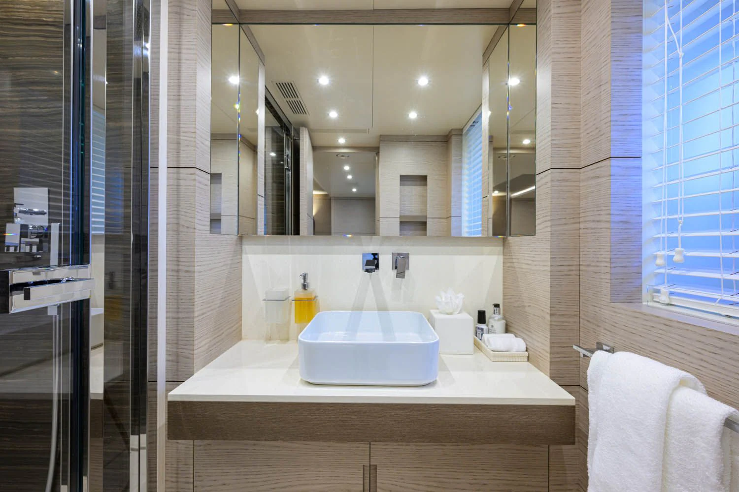 a bathroom with a large mirror aboard COFINA Yacht for Sale