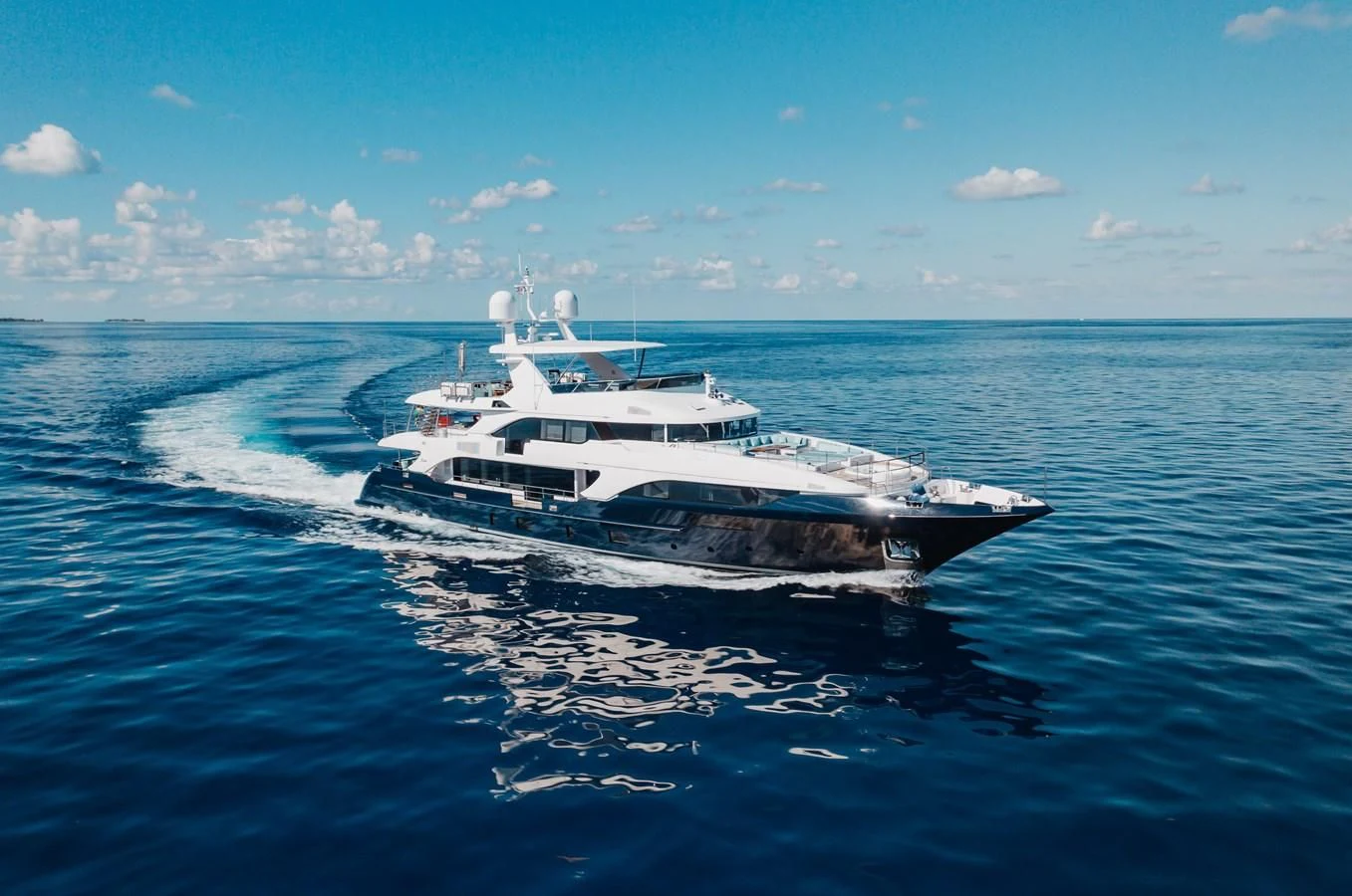 a white boat on the water aboard COFINA Yacht for Sale