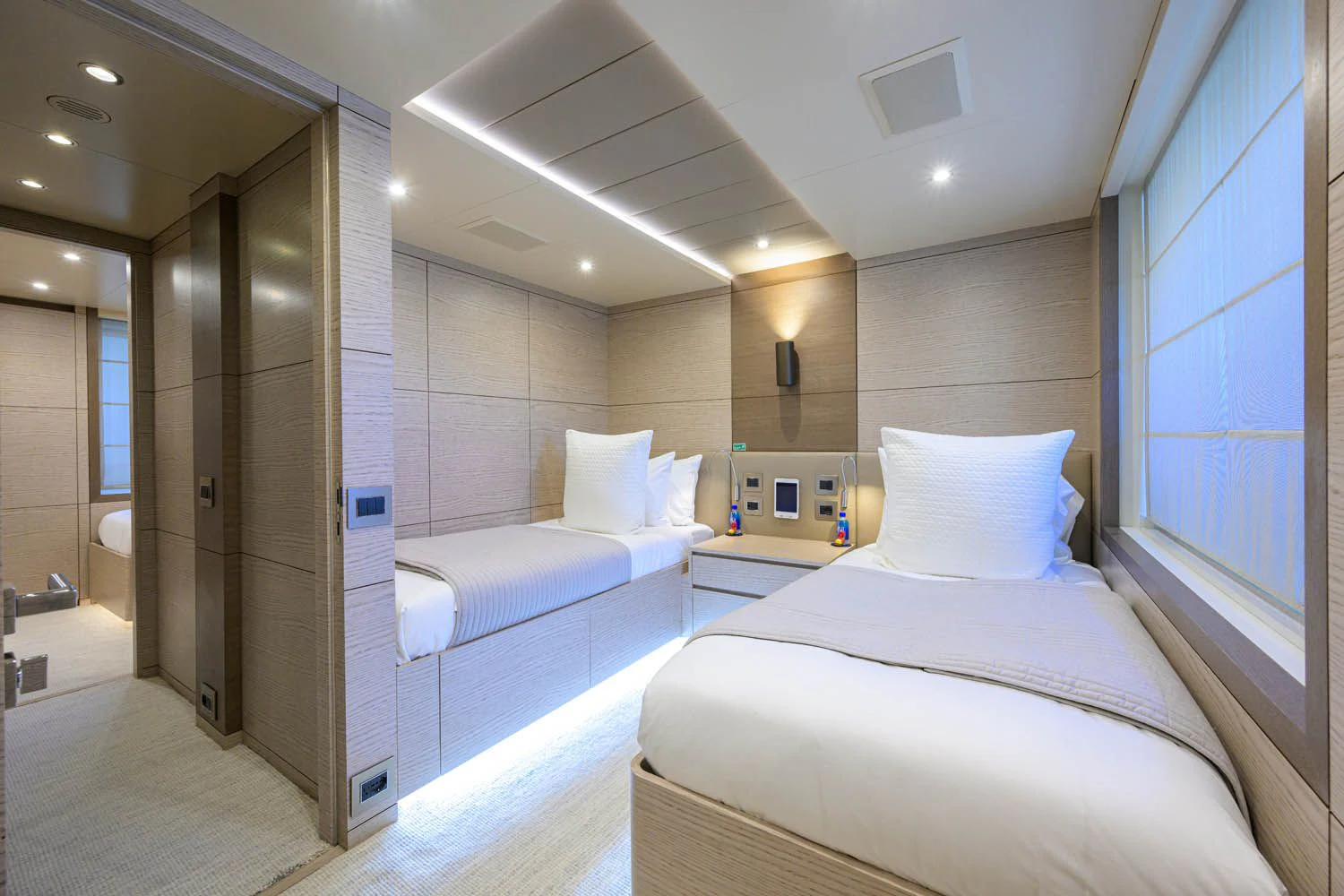 a room with a couple of beds aboard COFINA Yacht for Sale