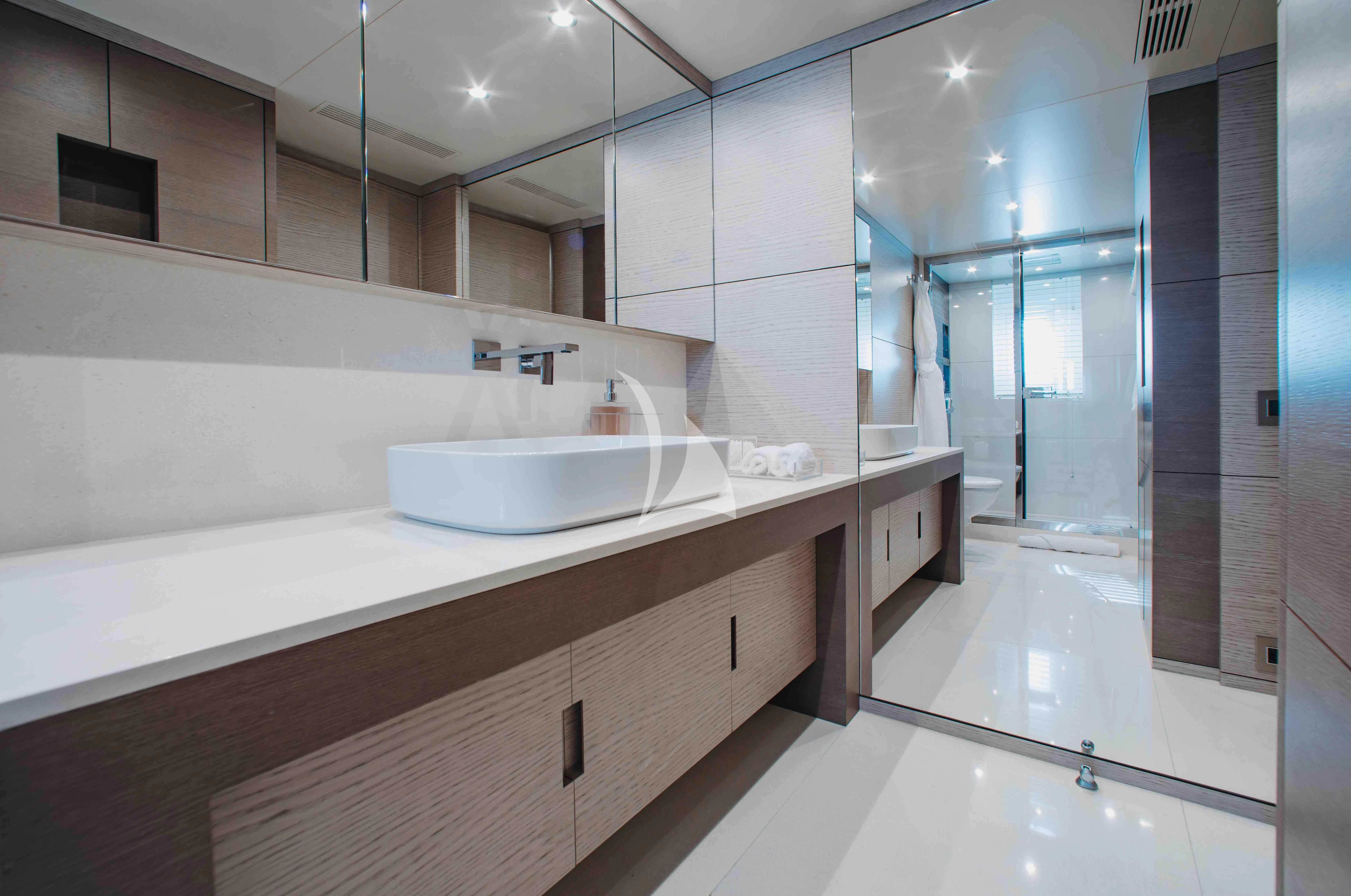 a bathroom with a large countertop aboard COFINA Yacht for Sale