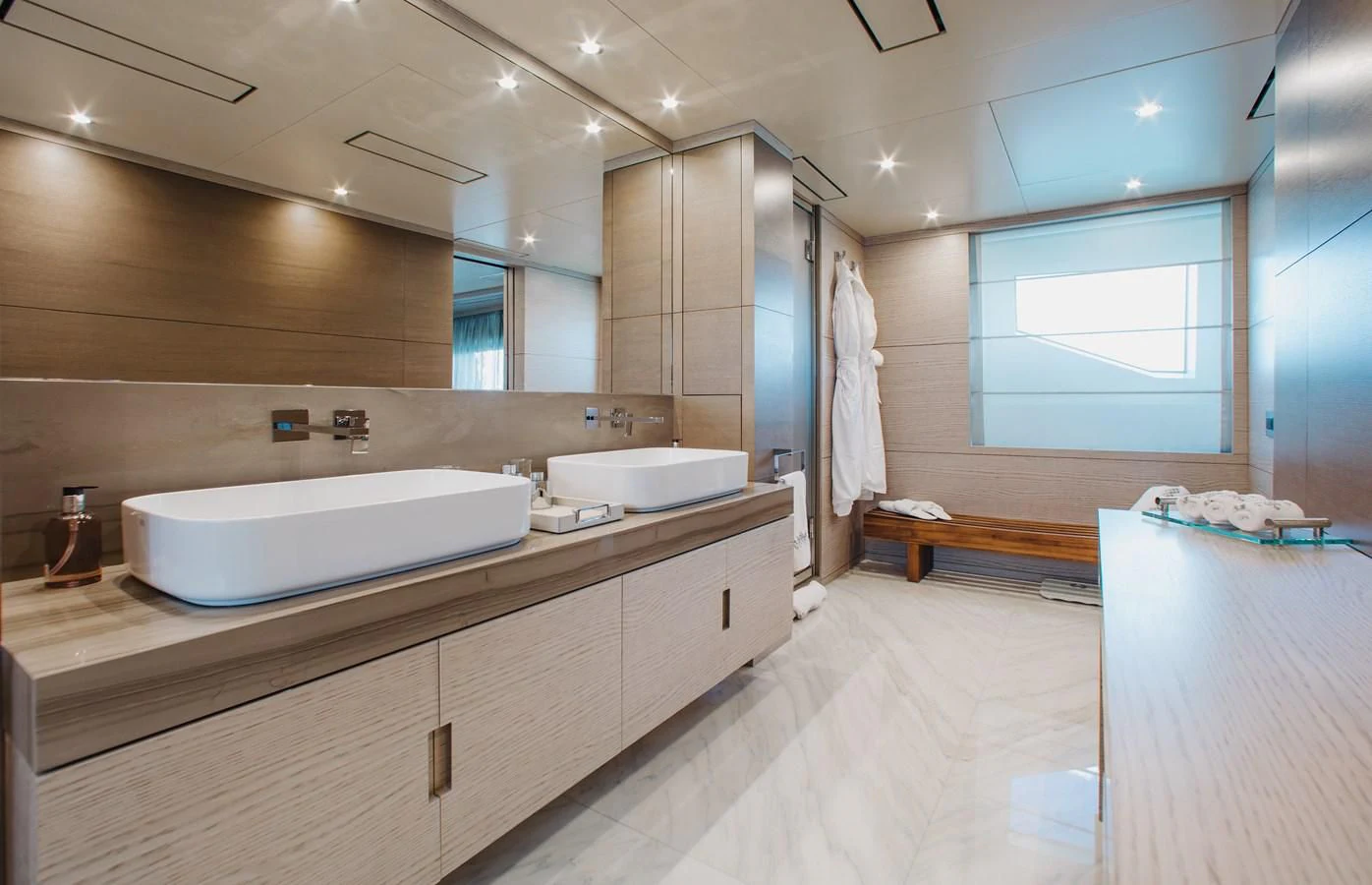 a bathroom with a large countertop aboard COFINA Yacht for Sale