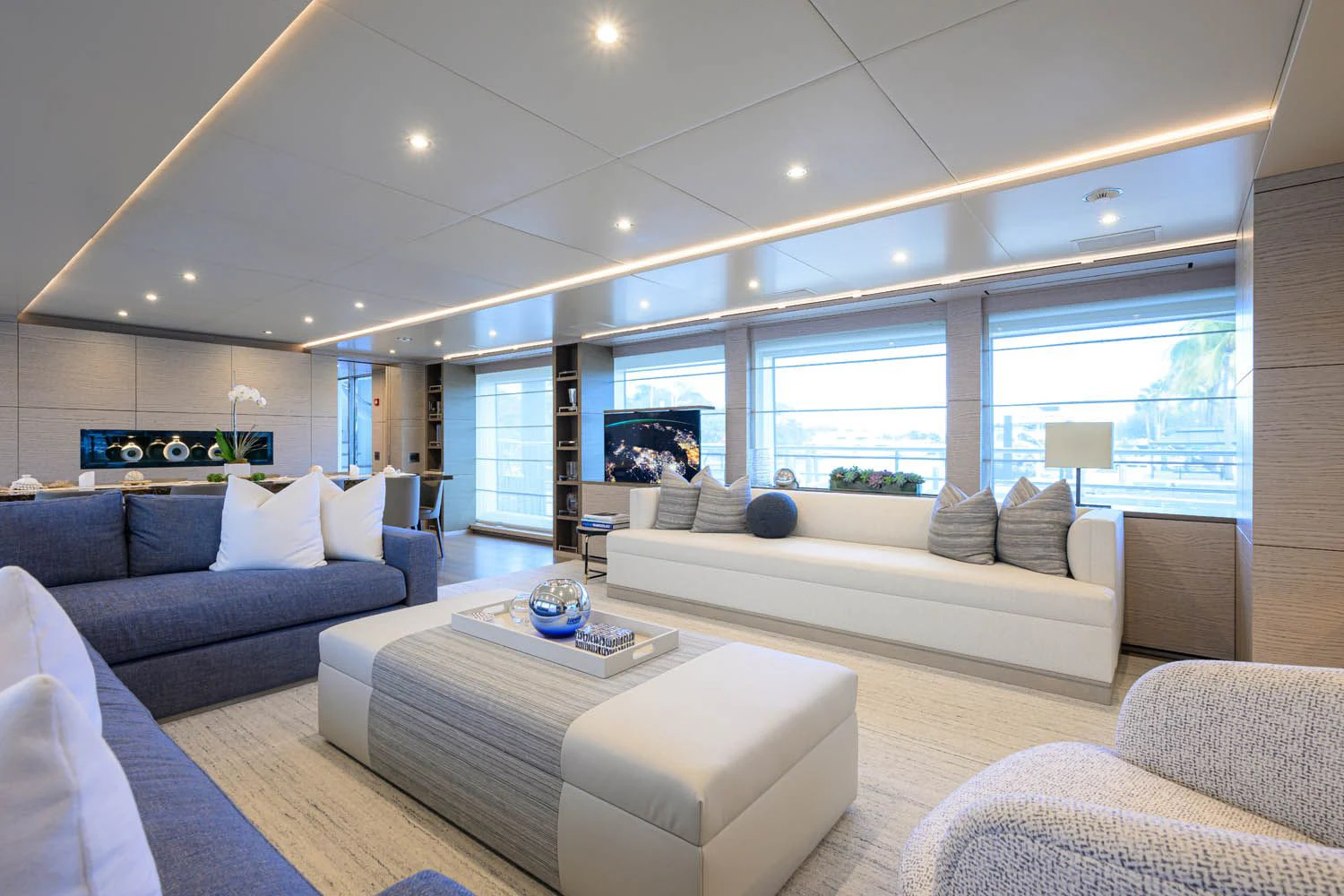 a living room with a large window aboard COFINA Yacht for Sale