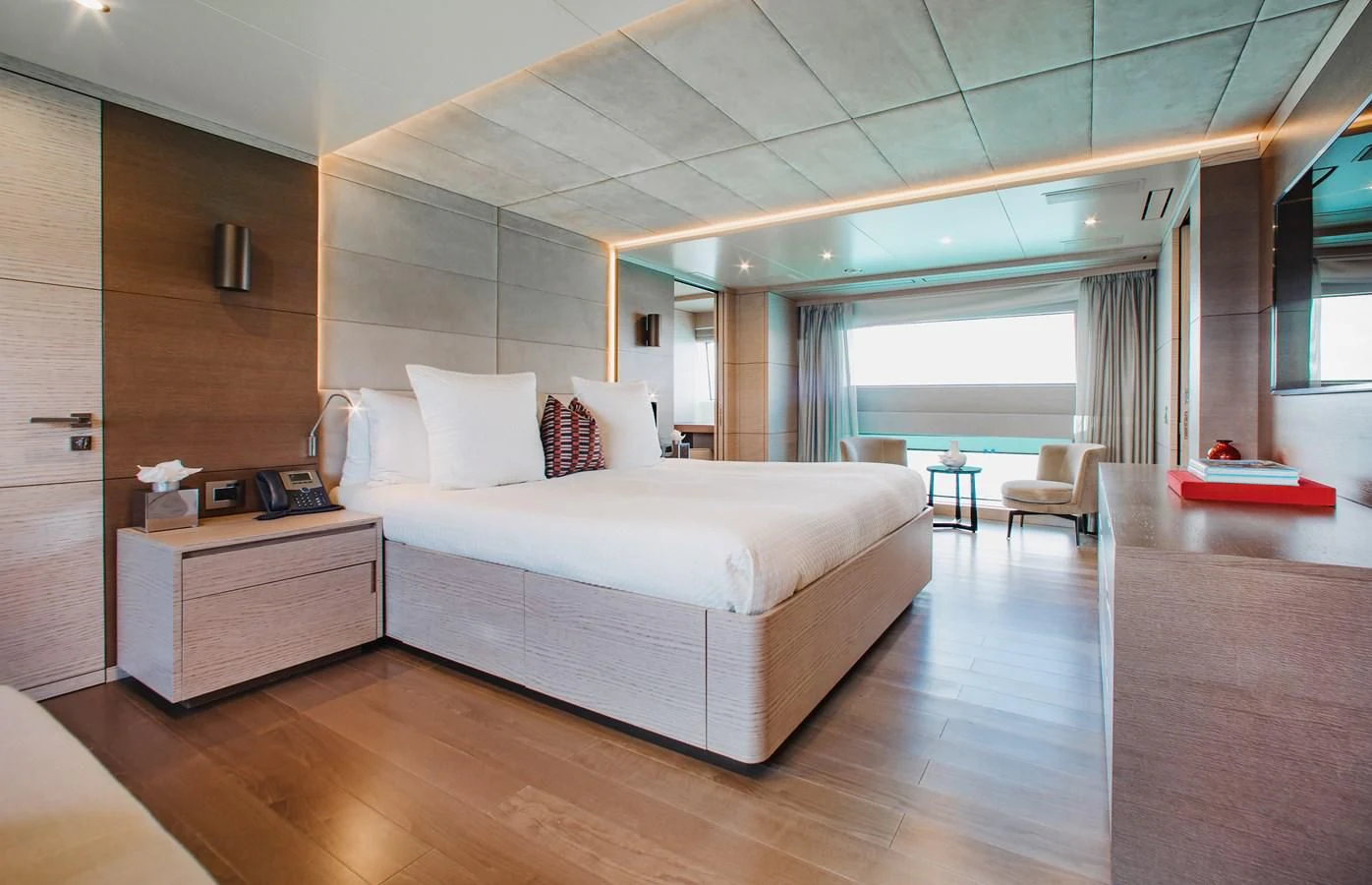 a large bedroom with a large bed aboard COFINA Yacht for Sale