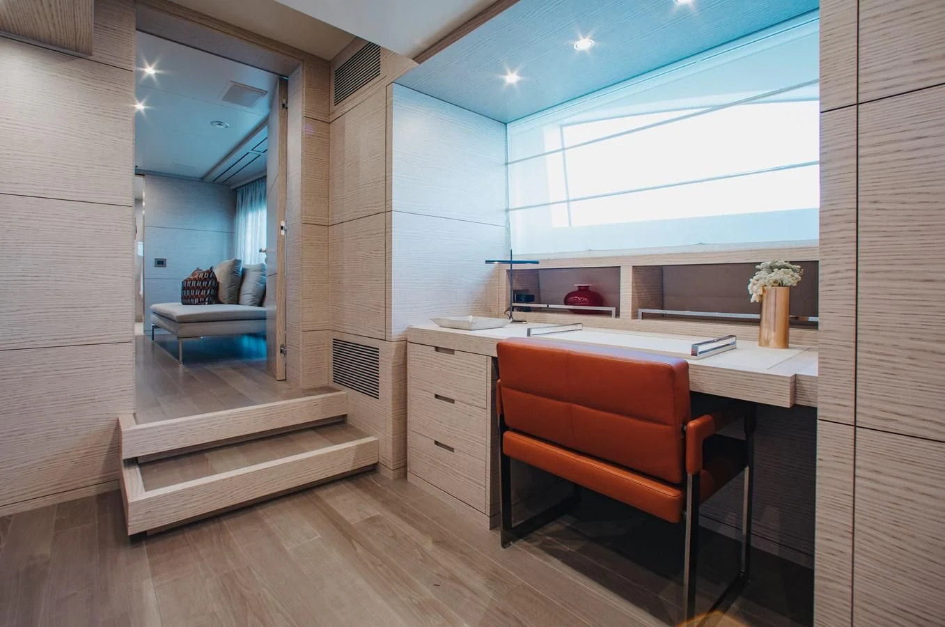 a room with a desk and a chair aboard COFINA Yacht for Sale