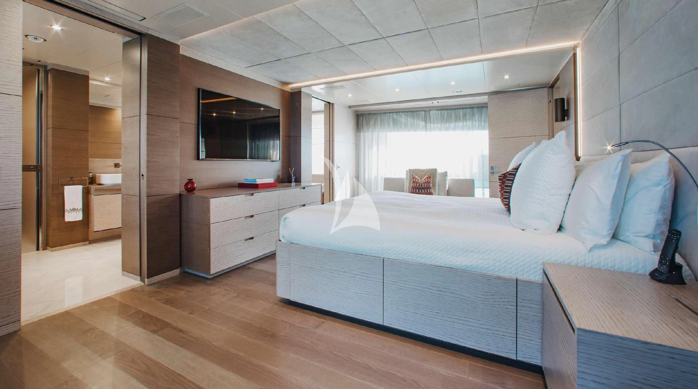 a bedroom with a bed and a desk aboard COFINA Yacht for Sale