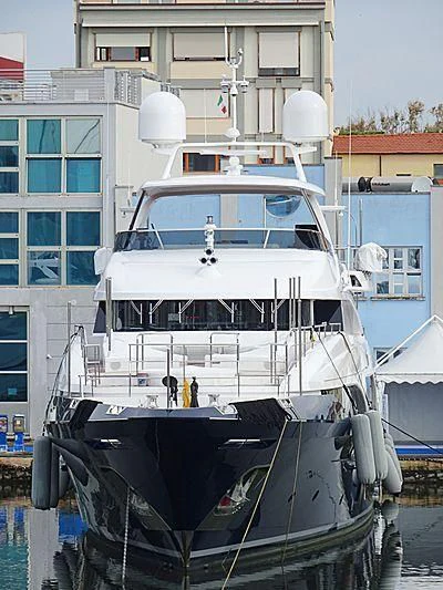 a white boat in a harbor aboard COFINA Yacht for Sale