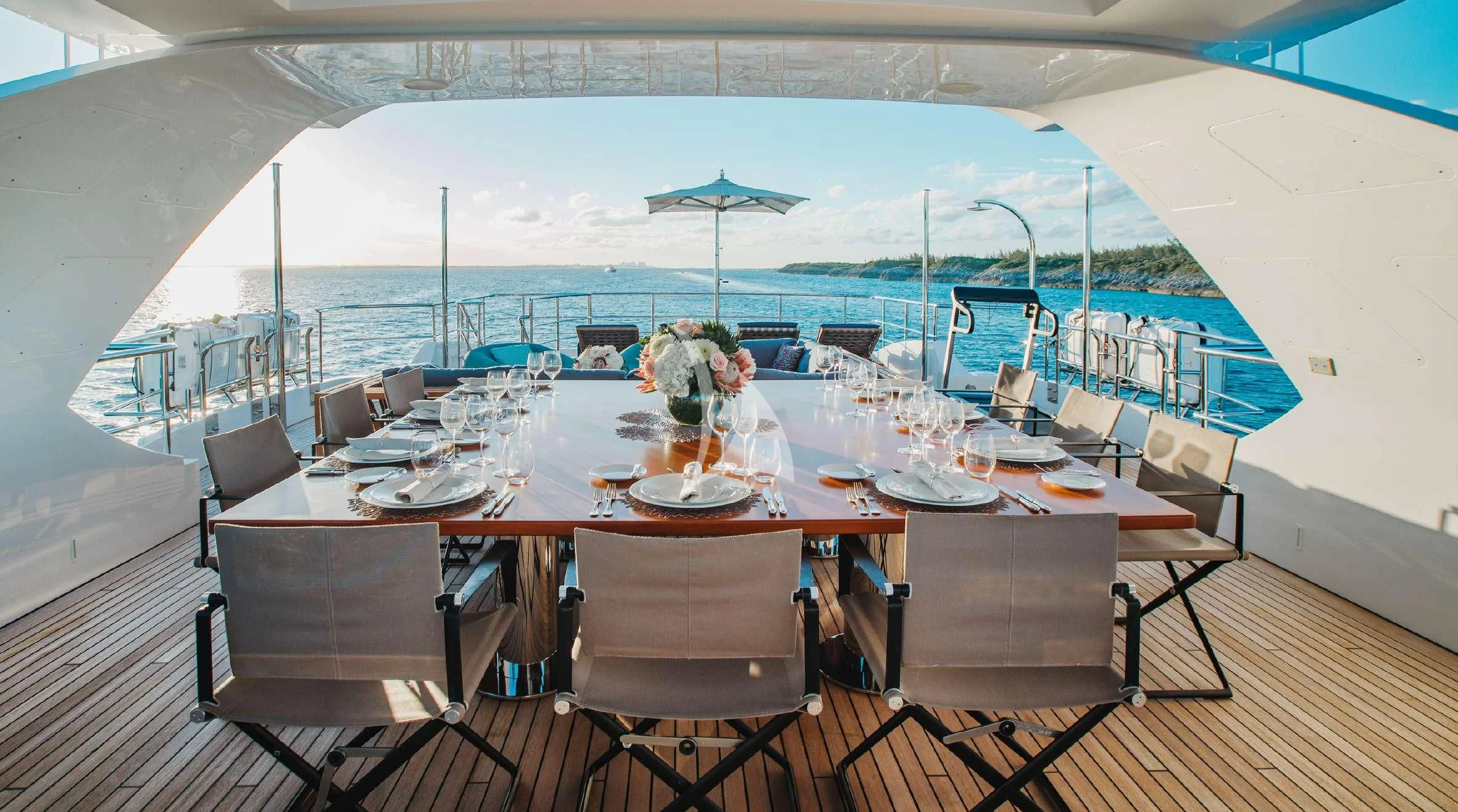 a large table with chairs around it aboard COFINA Yacht for Sale