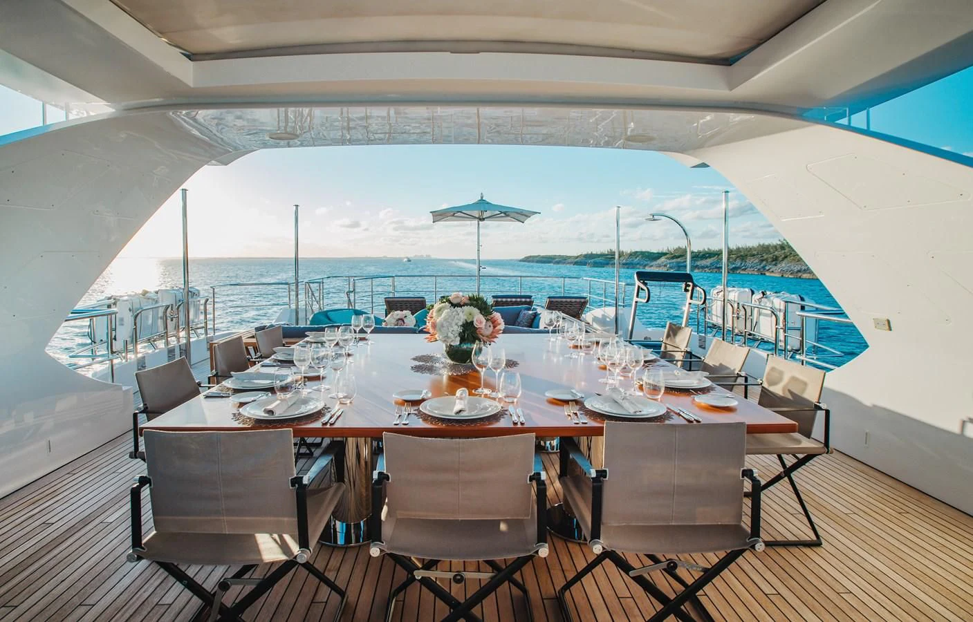 a large tent with tables and chairs aboard COFINA Yacht for Sale