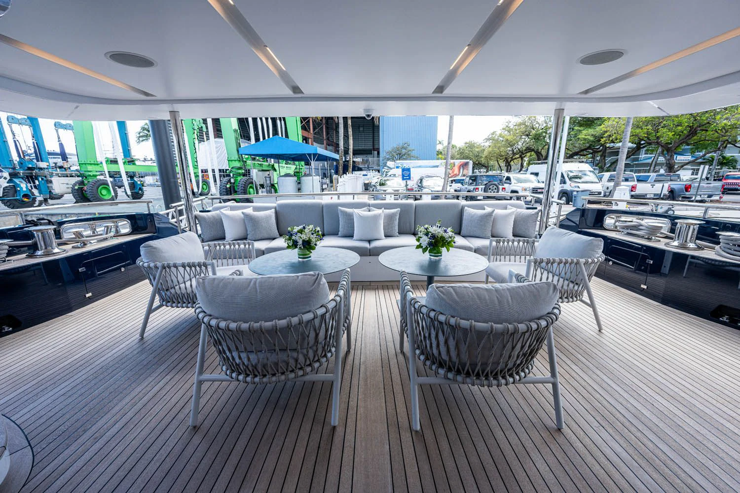 a large room with a table and chairs aboard COFINA Yacht for Sale