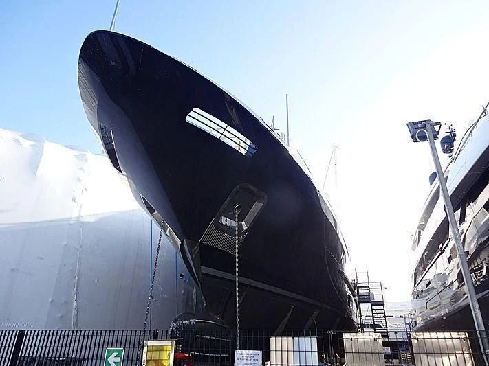 a large black airplane aboard COFINA Yacht for Sale