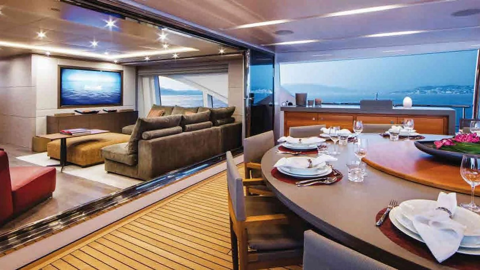 a living room with a large screen aboard COFINA Yacht for Sale
