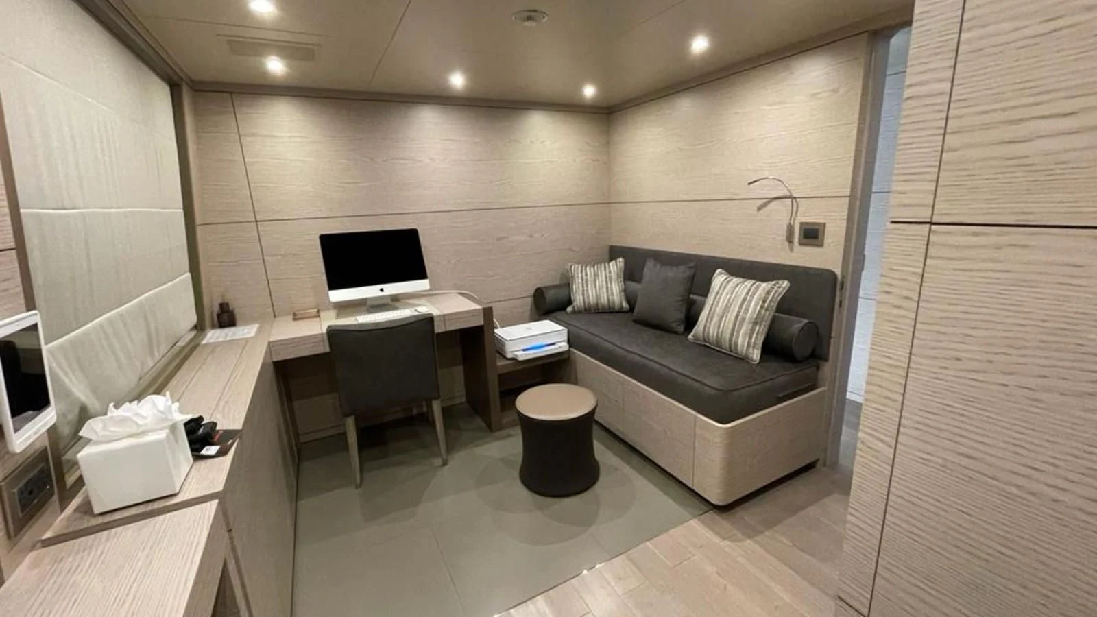 a room with a couch and a desk aboard COFINA Yacht for Sale