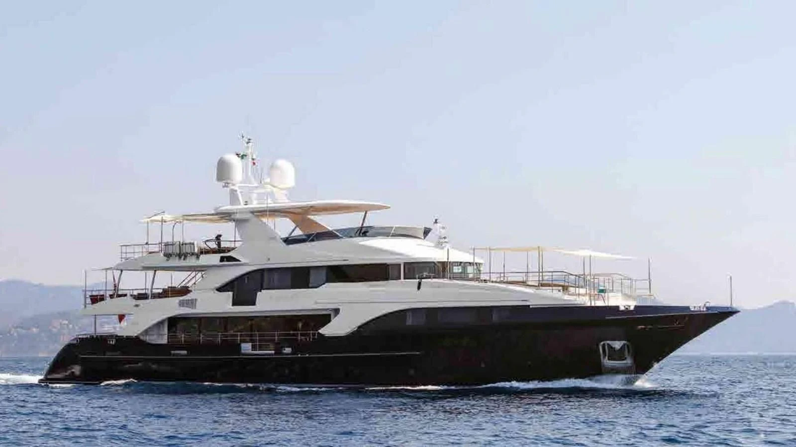 a large ship in the water aboard COFINA Yacht for Sale