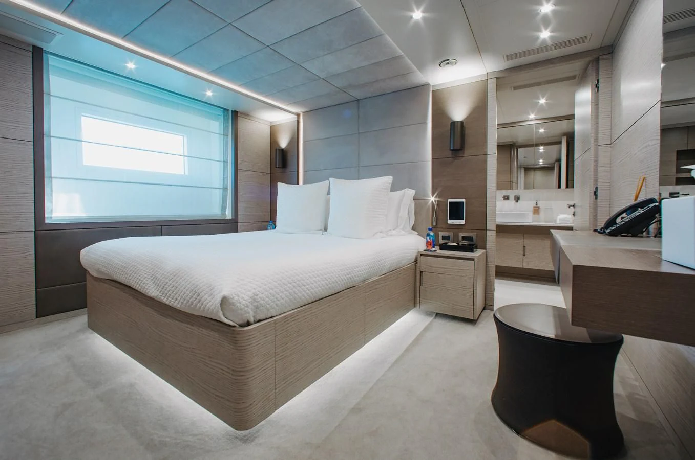 a room with a bed and a window aboard COFINA Yacht for Sale