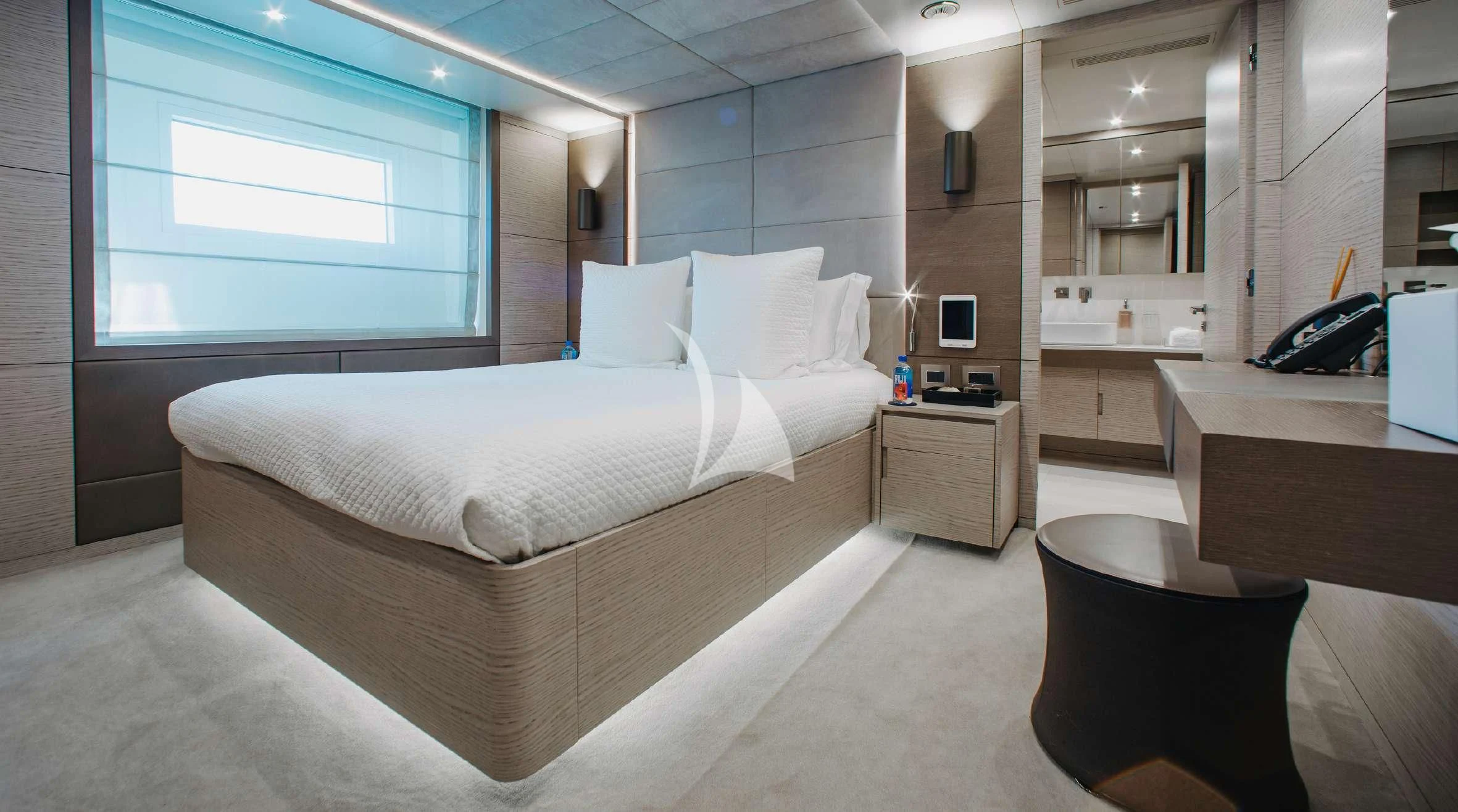 a room with a bed and a desk aboard COFINA Yacht for Sale