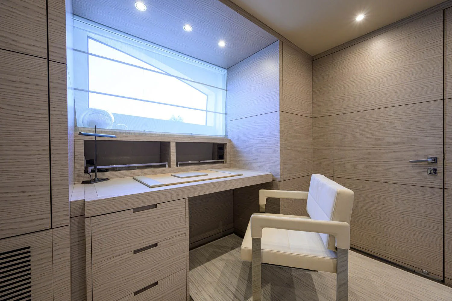 a room with a desk and a chair aboard COFINA Yacht for Sale