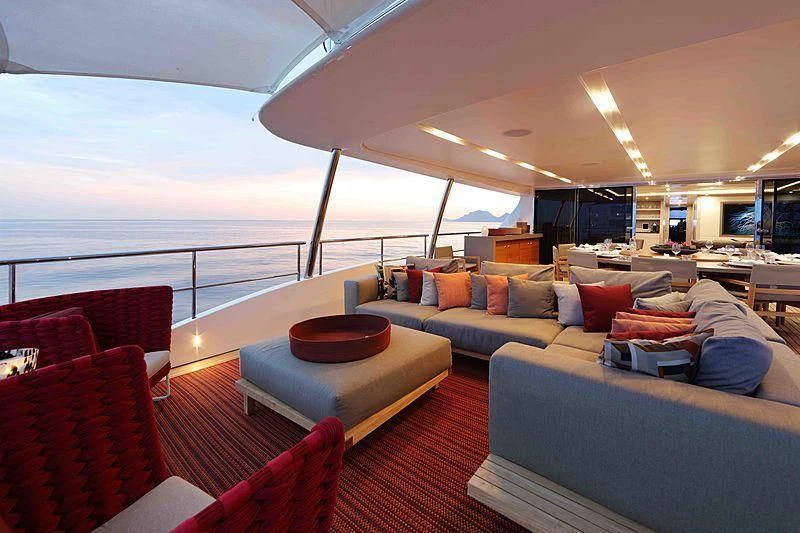 a large living room with a large balcony aboard COFINA Yacht for Sale