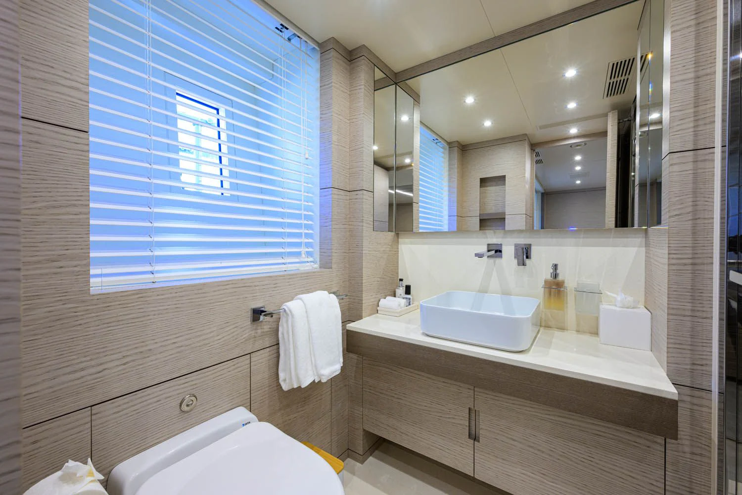 a bathroom with a large mirror aboard COFINA Yacht for Sale