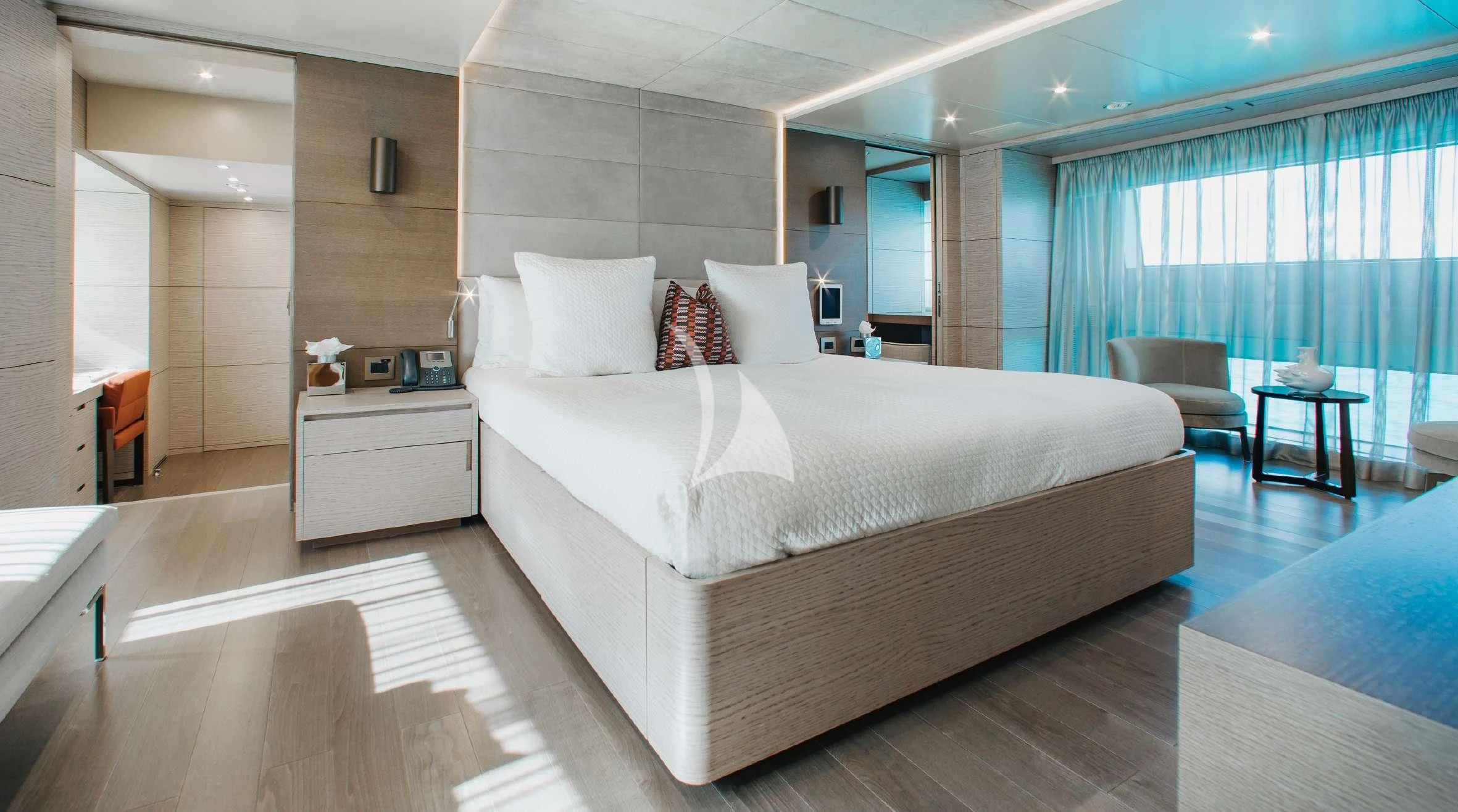 a large bed in a room aboard COFINA Yacht for Sale