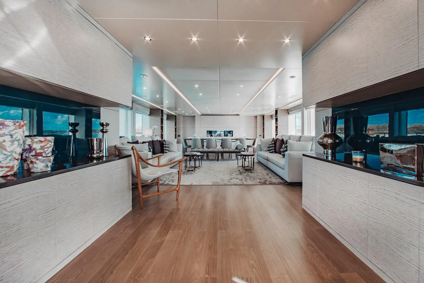 a room with a wood floor and a wood floor and a large window aboard COFINA Yacht for Sale