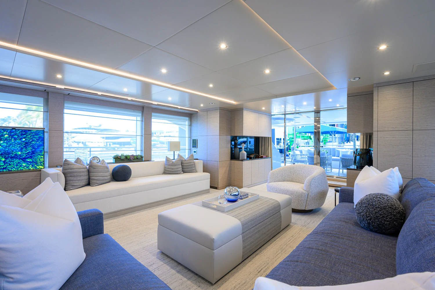 a living room with a large window aboard COFINA Yacht for Sale