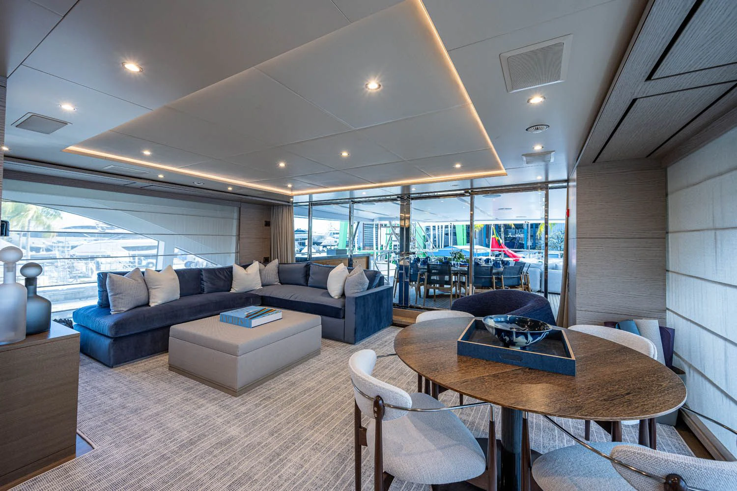 a living room with a large window aboard COFINA Yacht for Sale