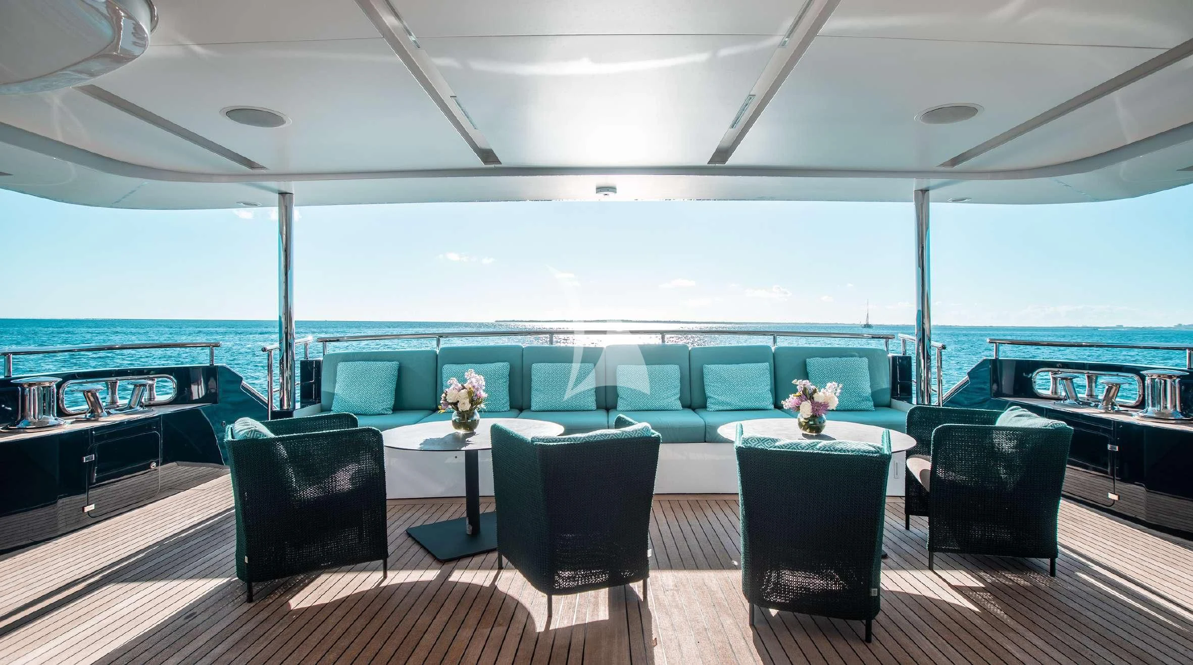 a room with a table chairs and a large window aboard COFINA Yacht for Sale