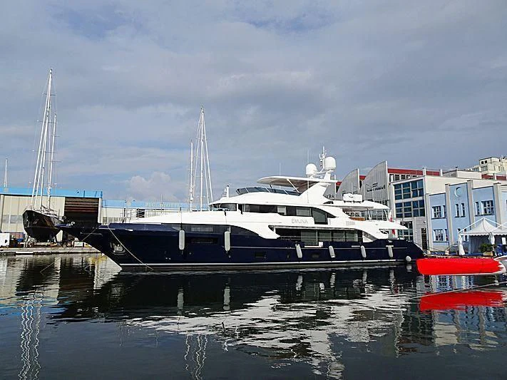 a boat docked at a pier aboard COFINA Yacht for Sale