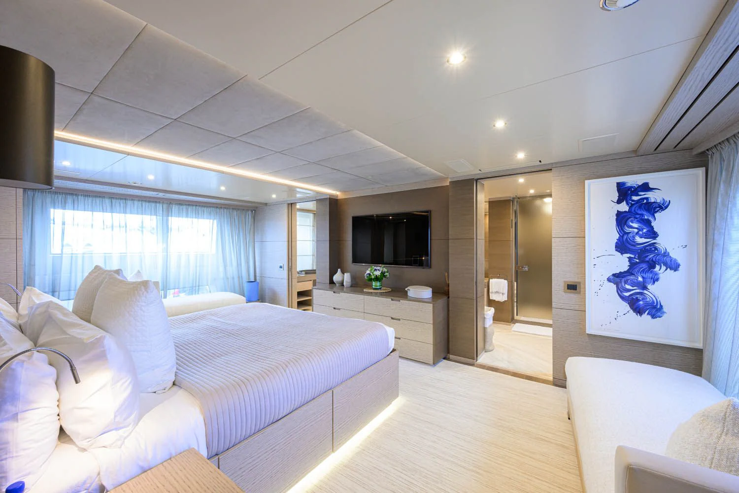 a bedroom with a bed and a tv aboard COFINA Yacht for Sale