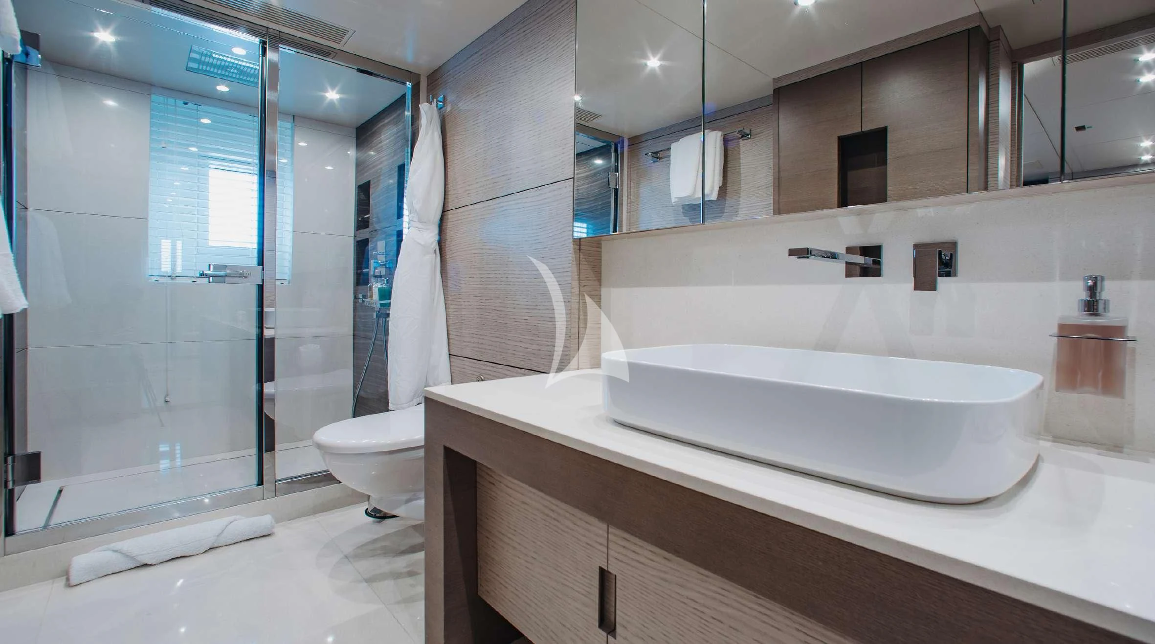 a bathroom with a glass shower aboard COFINA Yacht for Sale