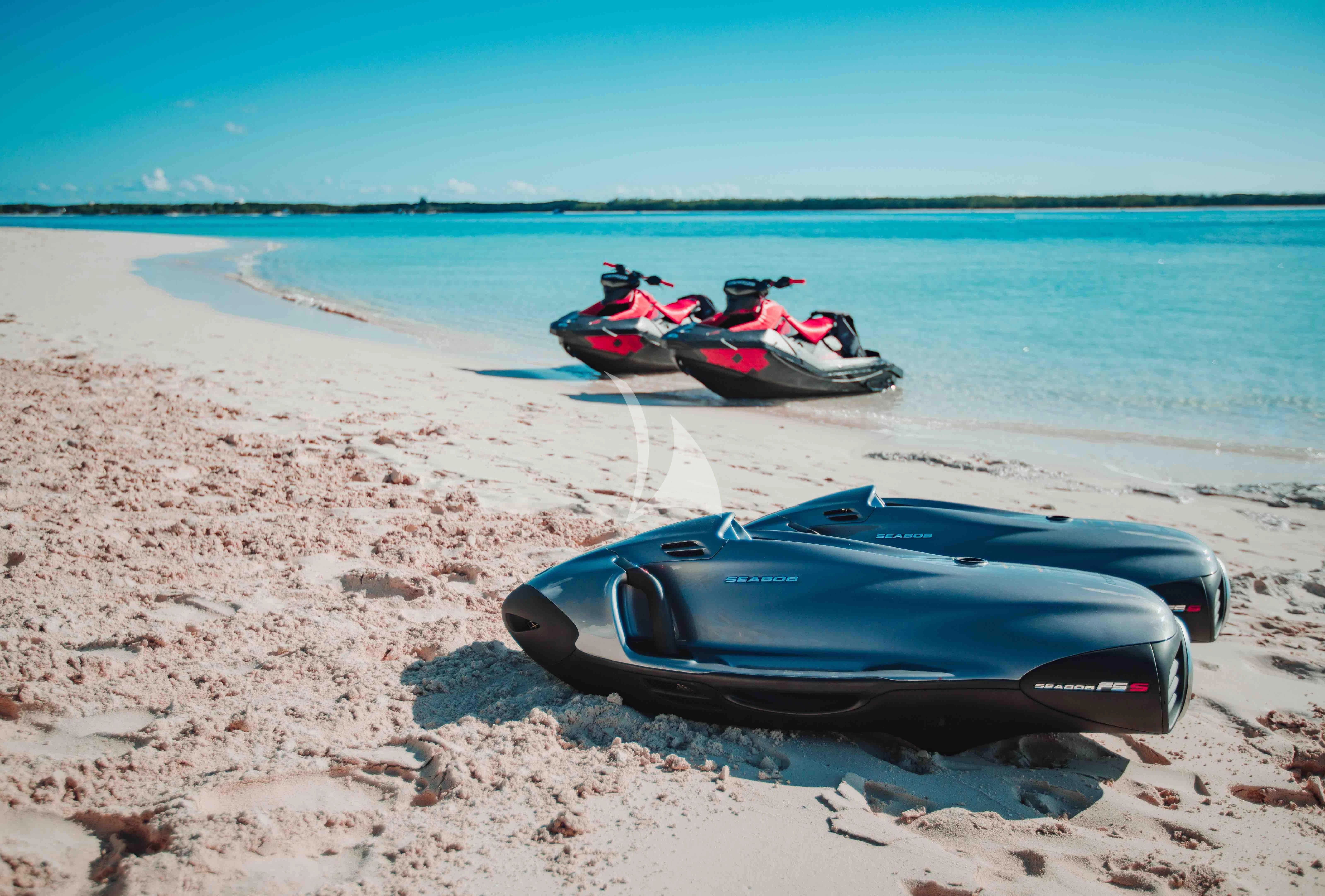 a couple of boats on a beach aboard COFINA Yacht for Sale
