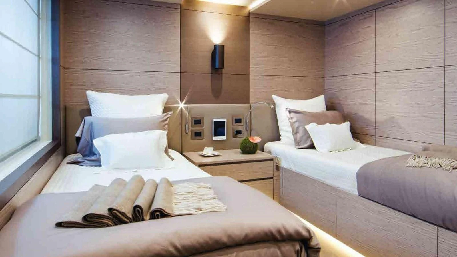 a room with two beds aboard COFINA Yacht for Sale