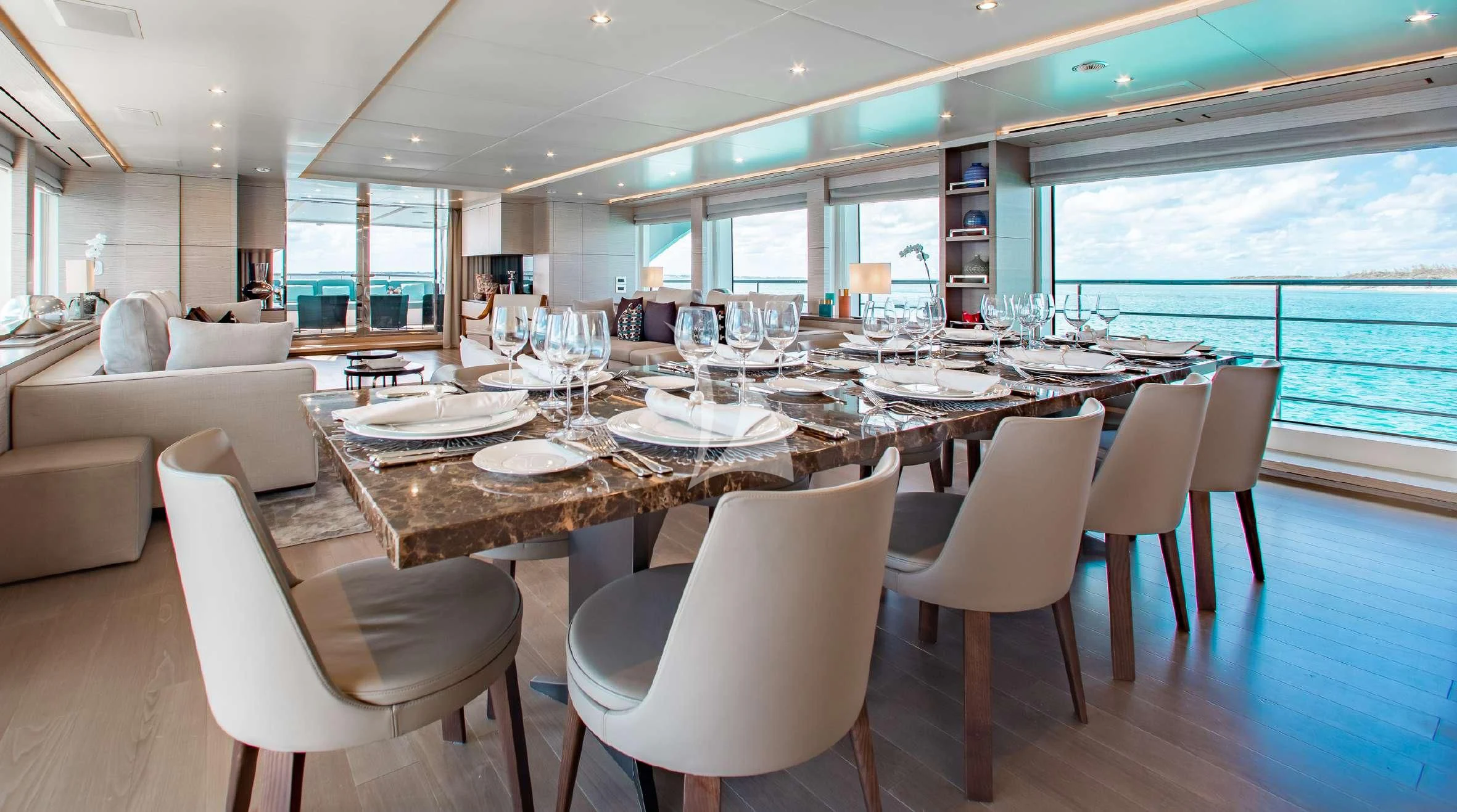 a large dining room with a large table and chairs aboard COFINA Yacht for Sale