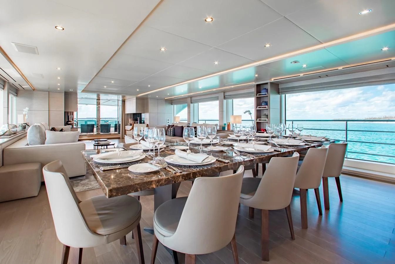 a large dining room with a large table and chairs aboard COFINA Yacht for Sale