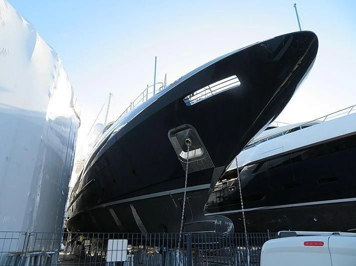 a close-up of a black airplane aboard COFINA Yacht for Sale
