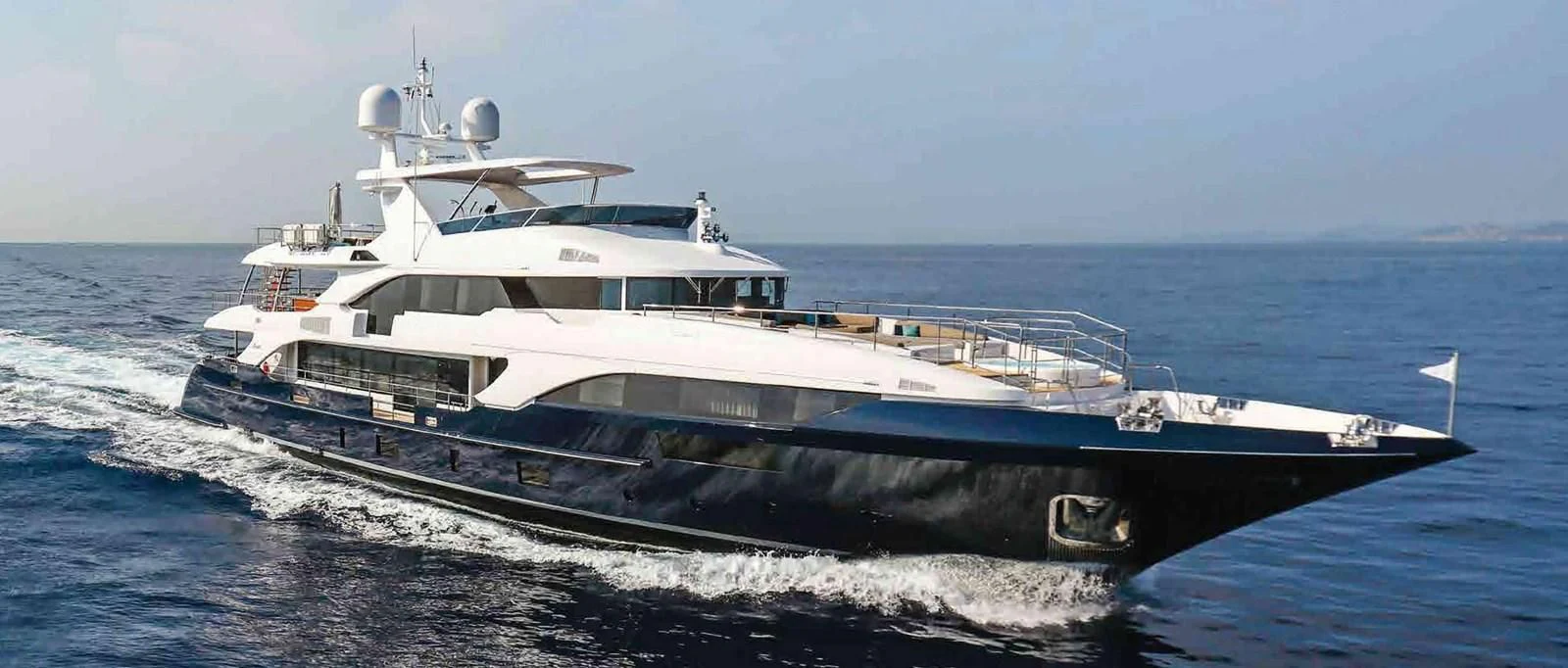 a large white yacht aboard COFINA Yacht for Sale