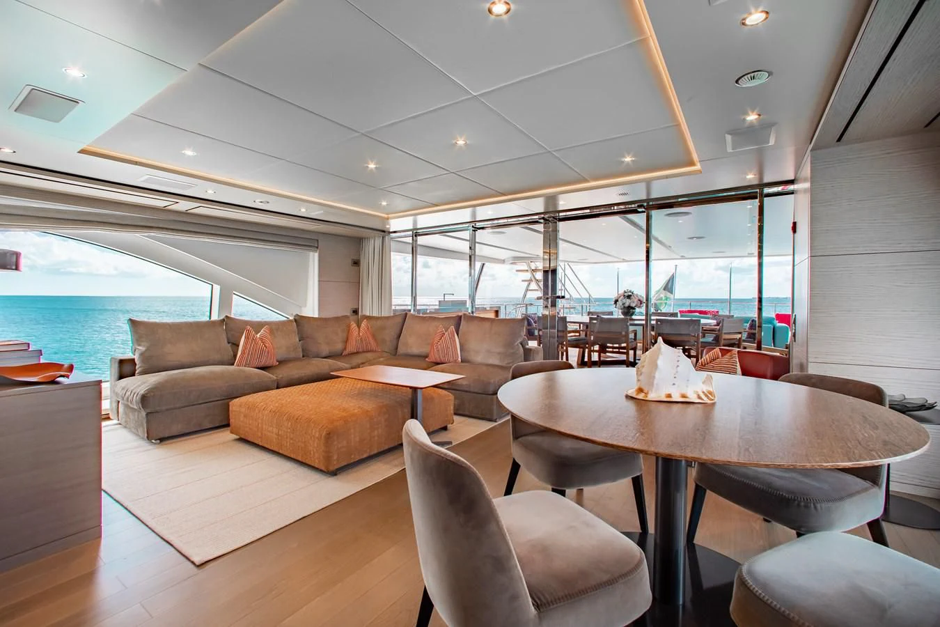 a living room with a large glass window aboard COFINA Yacht for Sale
