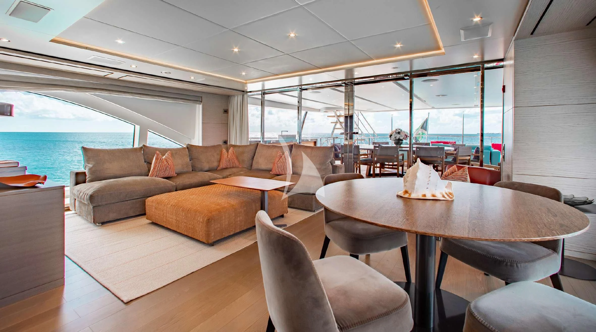 a living room with a couch and a table aboard COFINA Yacht for Sale
