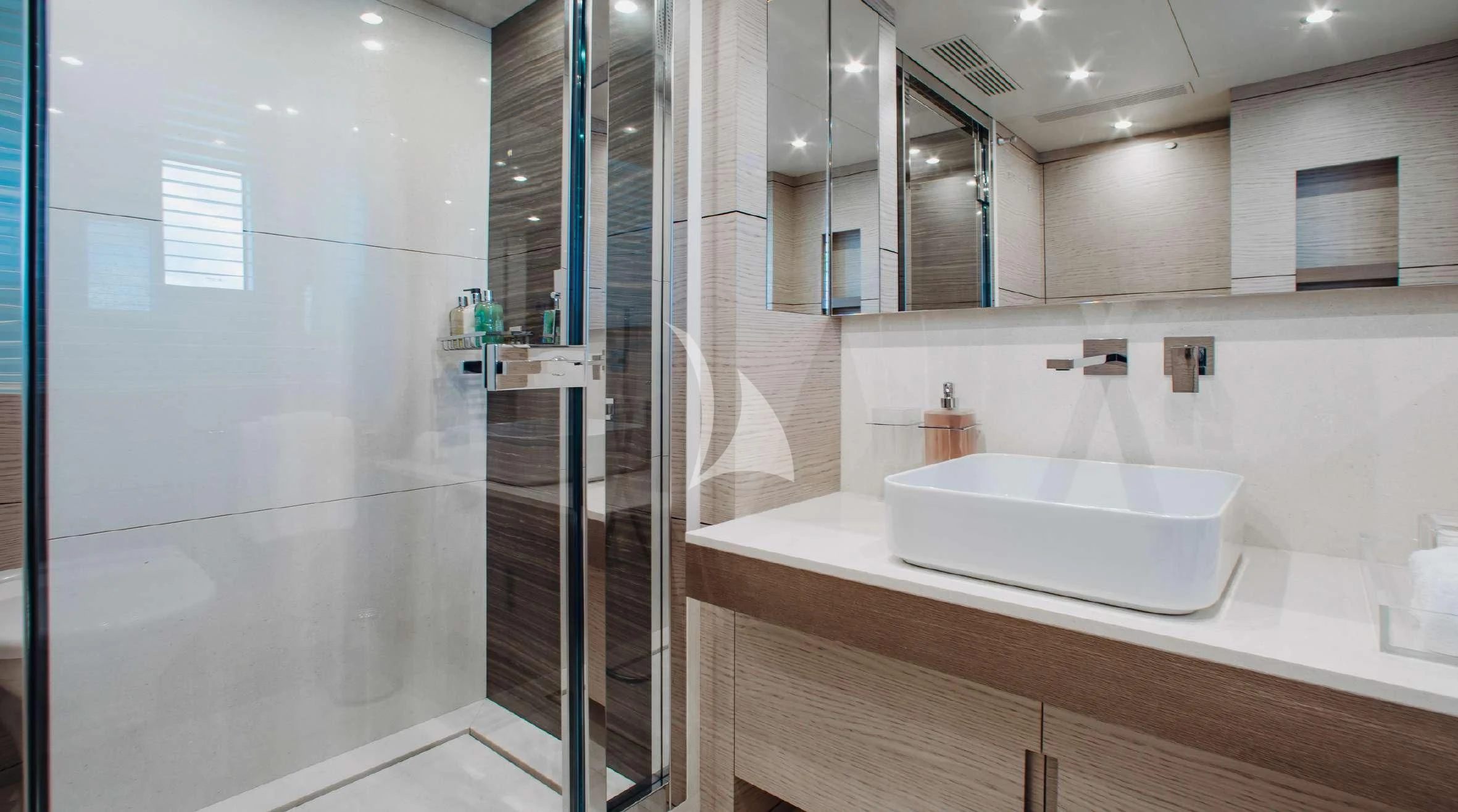 a bathroom with a large mirror aboard COFINA Yacht for Sale