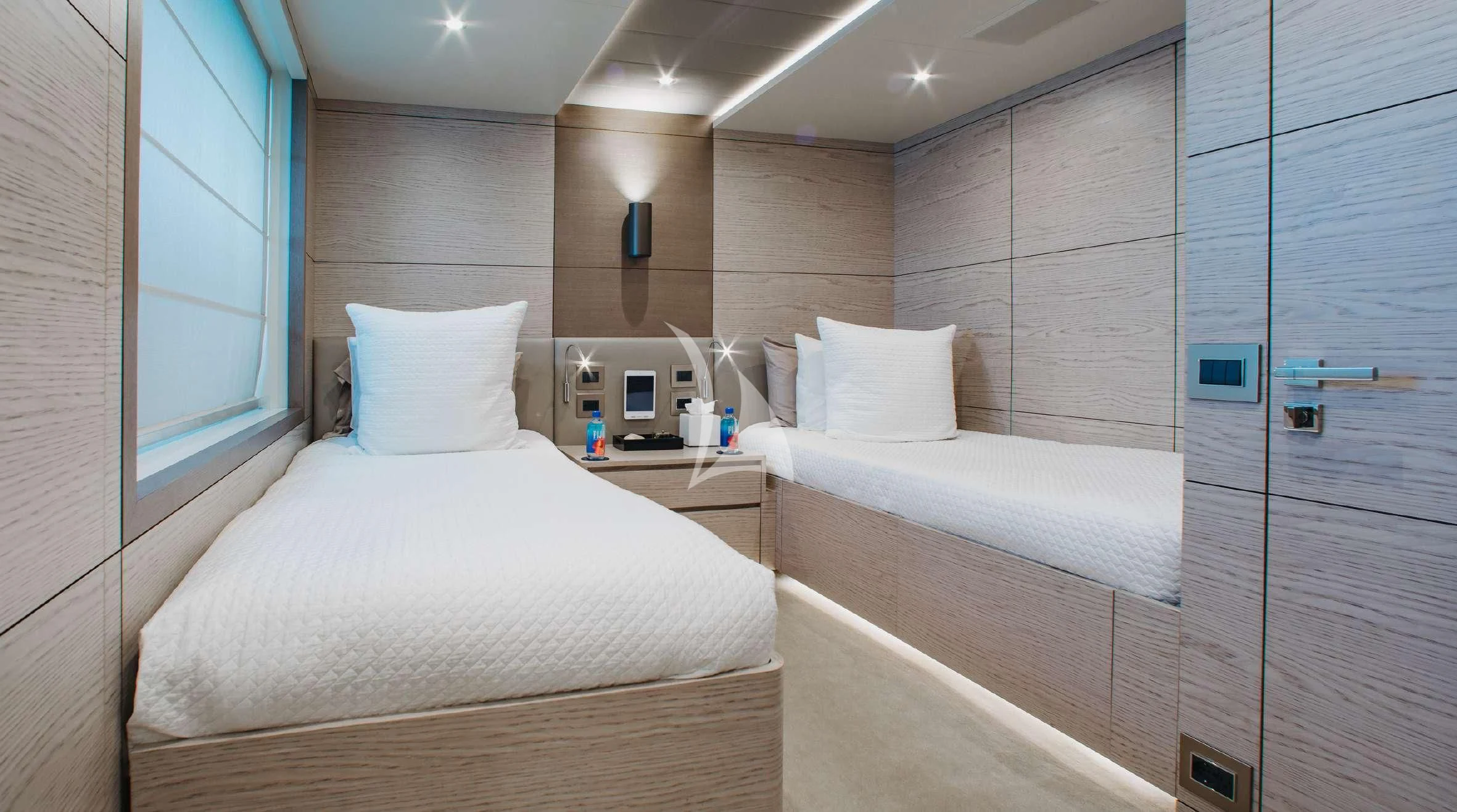 a room with two beds aboard COFINA Yacht for Sale